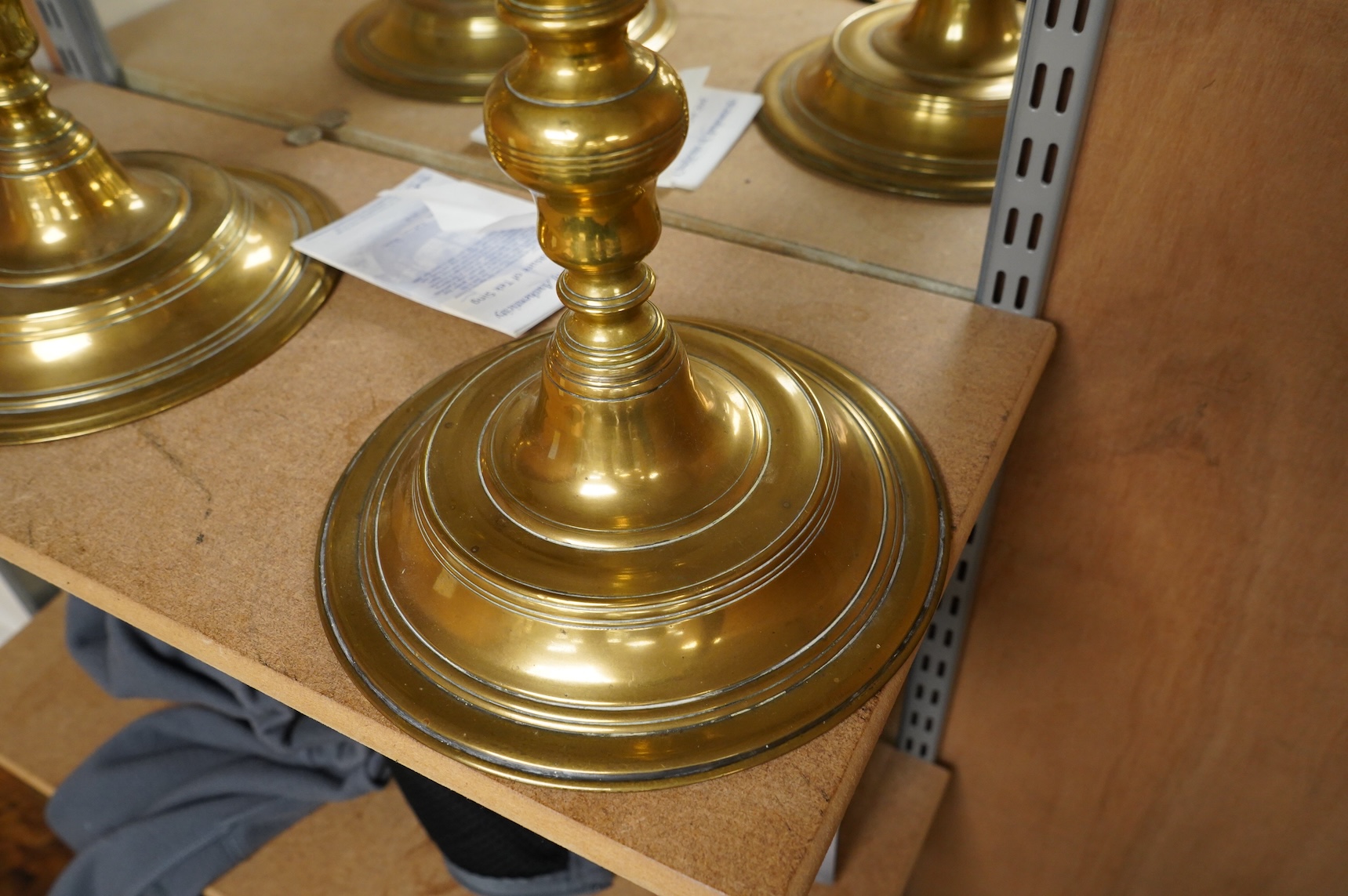 A pair of Juddah Sabbath five light brass candlesticks, 50cm high
